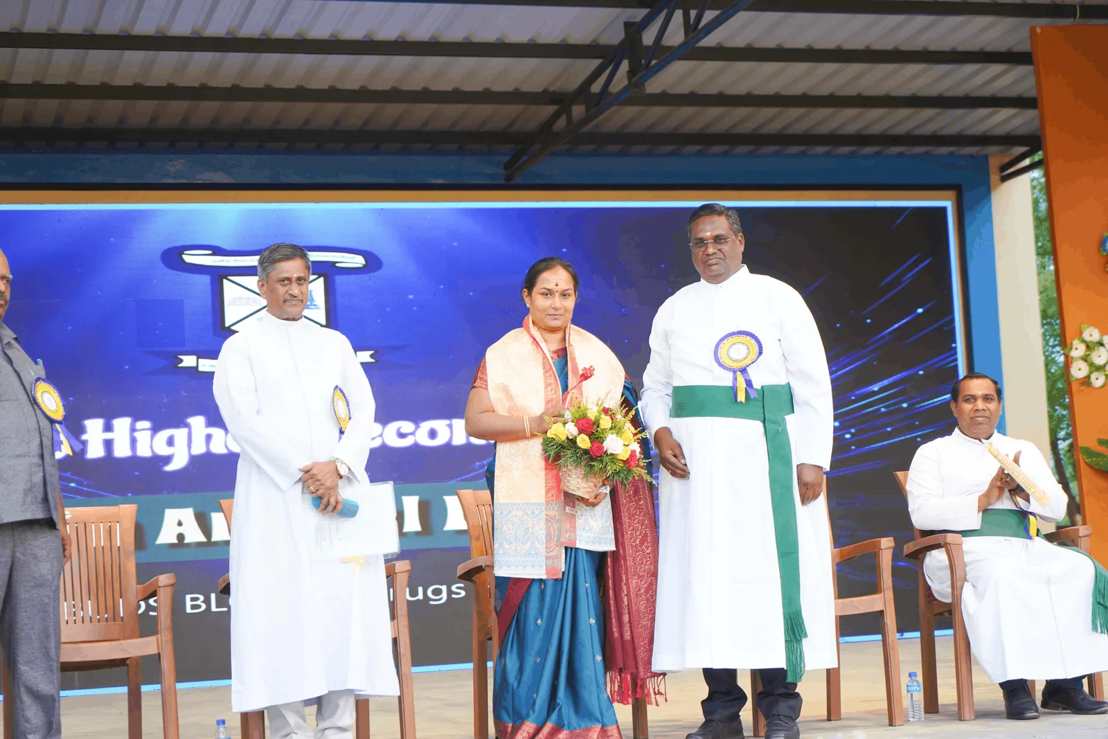 School management and guests at a St. Patrick's event